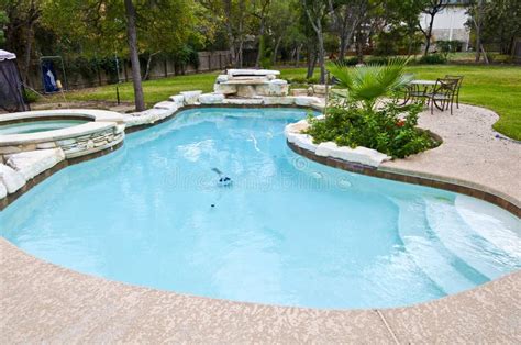 Backyard Swimming Pool stock photo. Image of table, flowers - 21977526