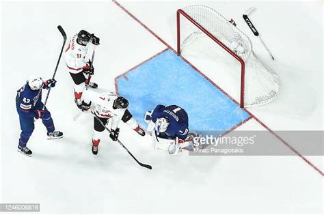 Goaltender Trey Augustine of Team United States makes a pad save on ...