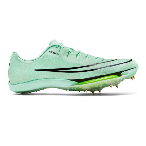 a green shoe with spikes on the side and black lettering that reads, nike vapor