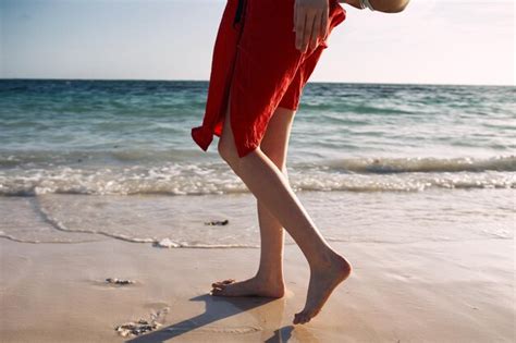 Premium Photo Low Section Of Person On Beach