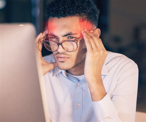 Man Headache And Computer In Stress Burnout Or Suffering Pain At Night By Office Desk