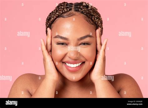 Portrait Of Happy Beautiful African American Woman Touching Her Face