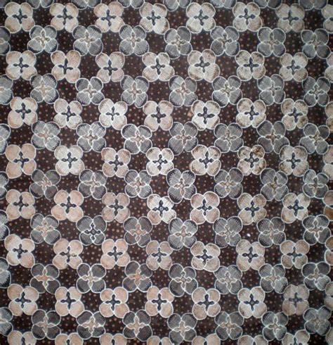 An Abstract Pattern Made Up Of Circles And Crosses On A Brown White