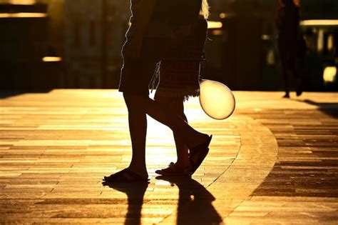 Premium Photo Silhouette Running Two Pairs Of Legs In Back Light Sunlight