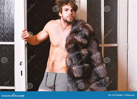 Guy Attractive Posing Fur Coat On Naked Body Richness And Luxury