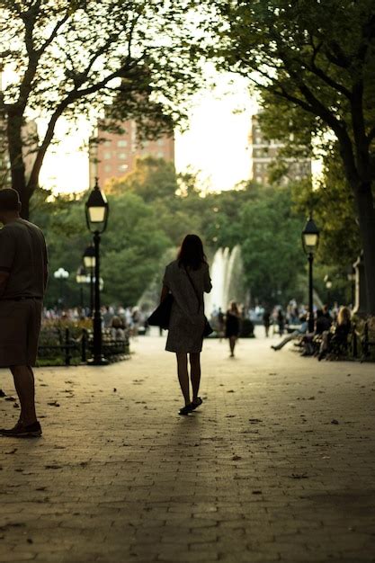 Premium Photo Rear View Of People Walking On Road