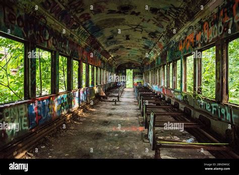 An abandoned train with graffiti Stock Photo - Alamy