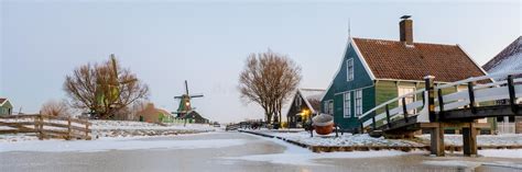 Snow At The Zaanse Schans Windmill Village During Winter With Snow