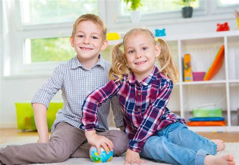premium photo portrait  smiling kids playing  home