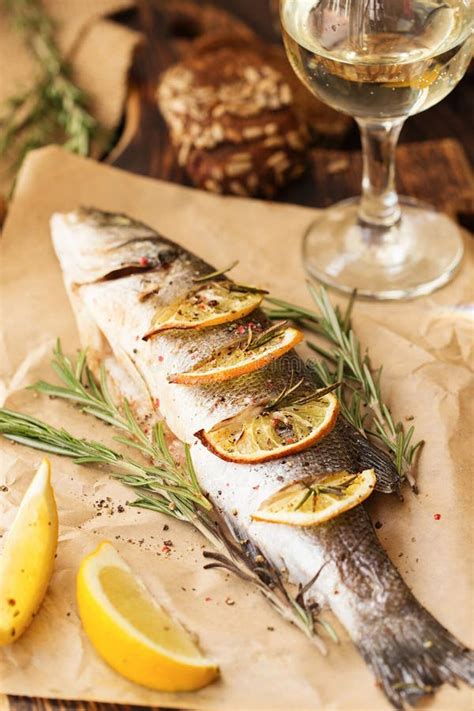 Oven Baked Sea Bass With Lemon And Herbs Fish Baked Entirely Stock