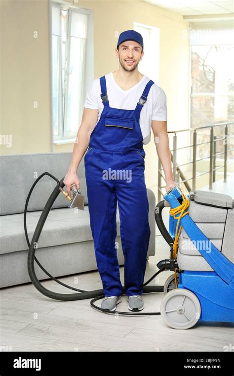 Man In Uniform Cleaning Flat Stock Photo Alamy