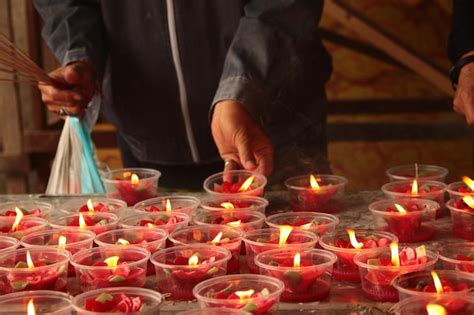 Premium Photo Asian People Lighting Candle Worship To Worship Angels