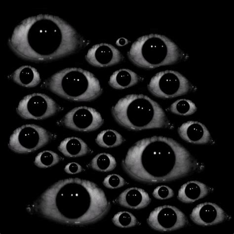 An Image Of Many Eyes In The Dark