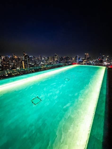 Rooftop Pool With Bangkok Skyline View At Sunset In Bangkok Thailand