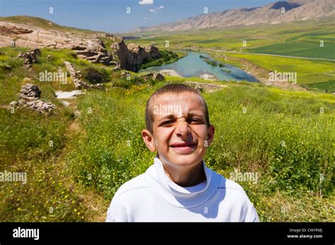 Funny Portrait Of Kurdish Boy In Tigris River Landscape Hasankeyf