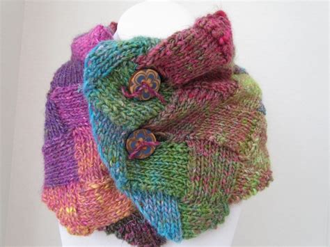 A Multicolored Knitted Scarf On Top Of A Mannequin Head