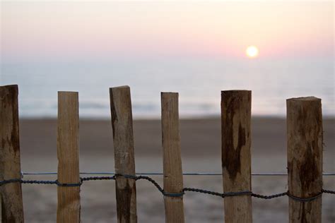 Free Images Sea Sand Fence Wood Sunset Sunlight Morning Wire