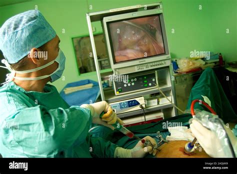 Laparoscopy Surgeon Performing A Tubal Ligation Operation By