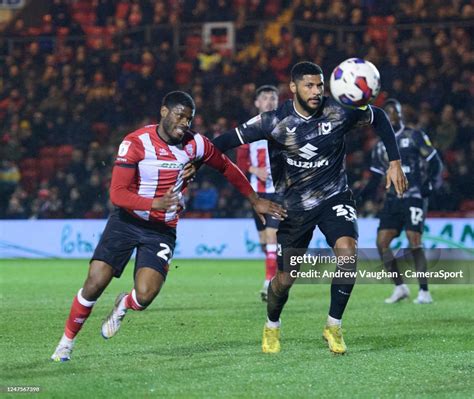 Lincoln Citys Tj Eyoma Vies For Possession With Milton Keynes Dons