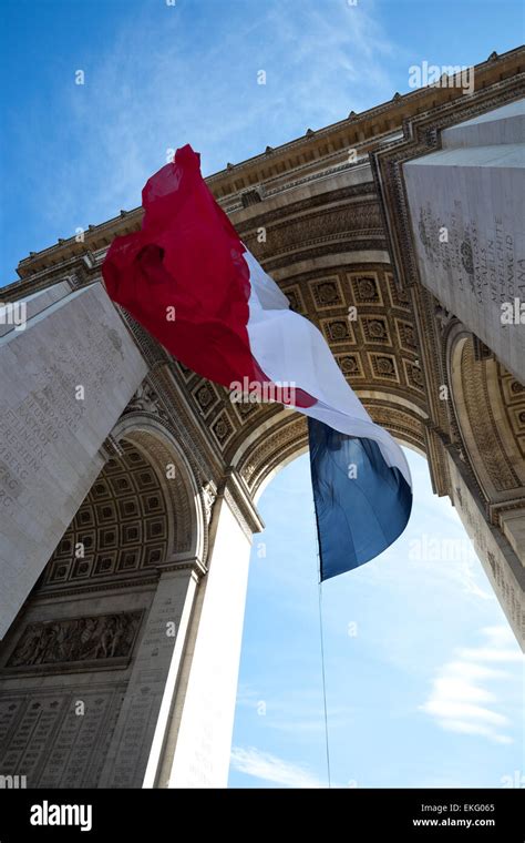 Waving French Flag at Arc de Triomphe Stock Photo - Alamy