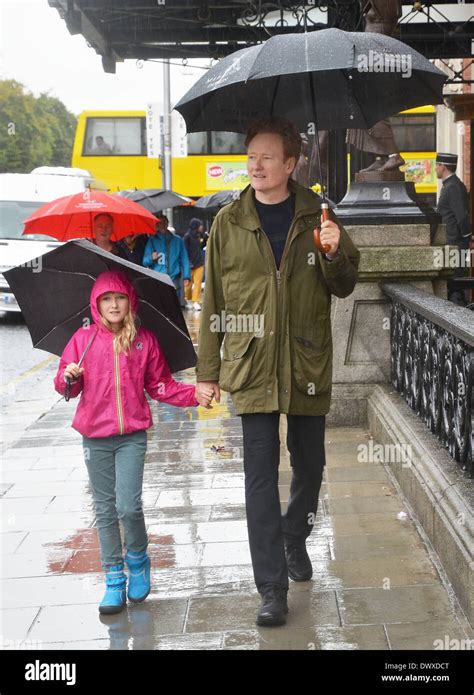 Conan O'Brien and his daughter Neve spotted walking in the rain under ...