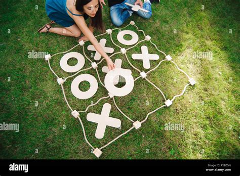 Friends Playing Tic Tac Toe On Green Grass Big Tic Tac Toe Game Guy