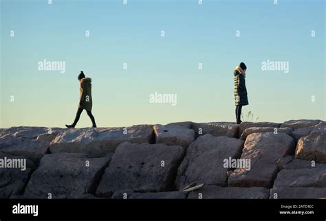 Two people walking away from each other hi-res stock photography and images - Alamy