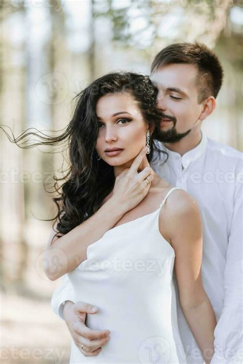 Young Happy Couple In Love Hugging Smiling And Having Fun In The