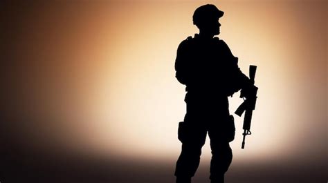 Premium AI Image | Soldier salute Silhouette on sunset sky War army military guard concept