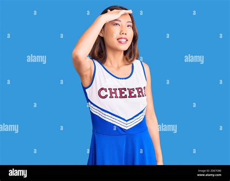 Young Beautiful Chinese Girl Wearing Cheerleader Uniform Very Happy And