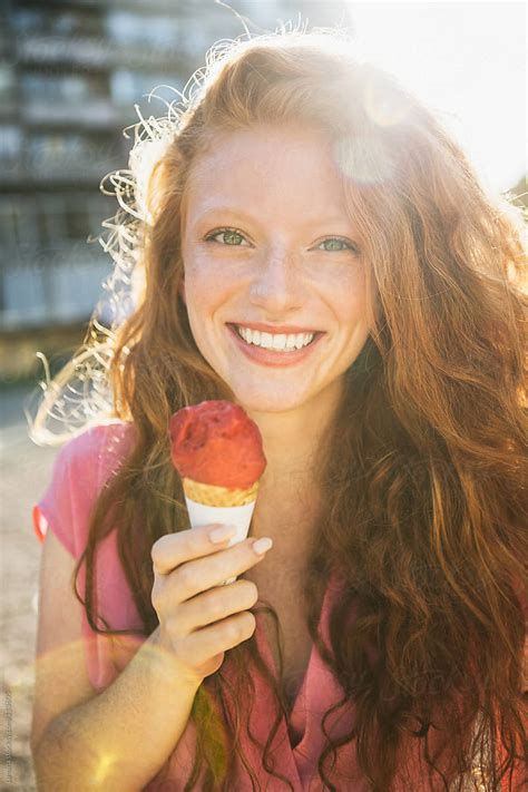 Smiling Woman Eating Ice Cream By Stocksy Contributor Lumina Stocksy