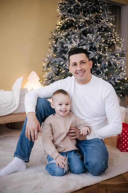 Premium Photo Happy Father With His Son Playing Home During Winter