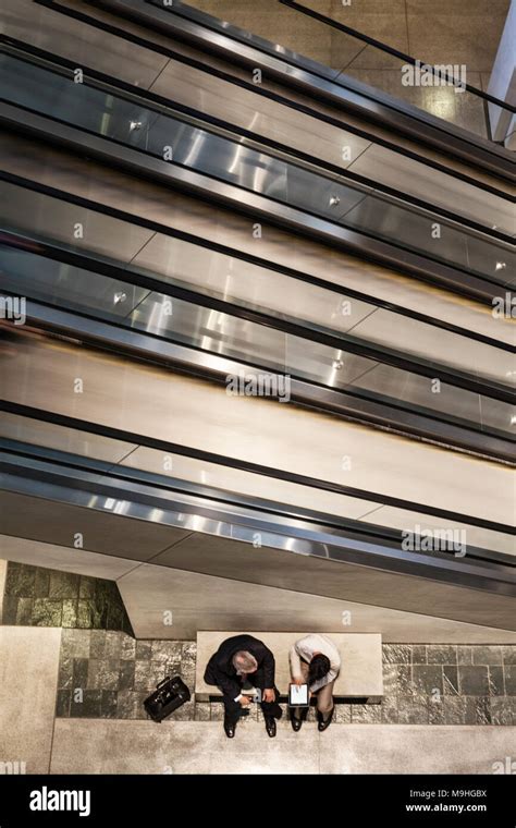 Man Sitting On Escalator Hi Res Stock Photography And Images Alamy