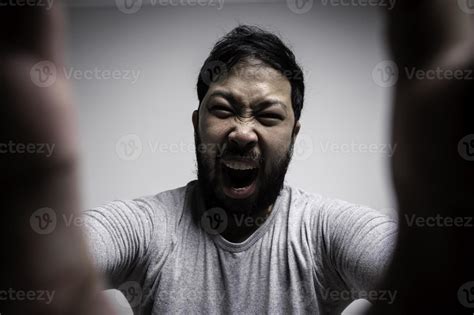 Portrait Of Asian Young Man On White Backgroundangry Man Concept