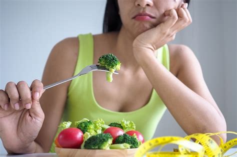 Premium Photo Slim Women Are Bored Of Eating Salad Every Day