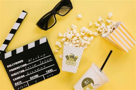 Premium PSD Top View Of Popcorn Cup With Clapperboard And Glasses