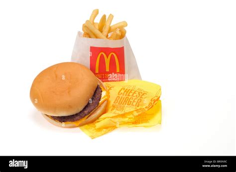 Mcdonalds Cheeseburger And French Fries On White Background Cutout