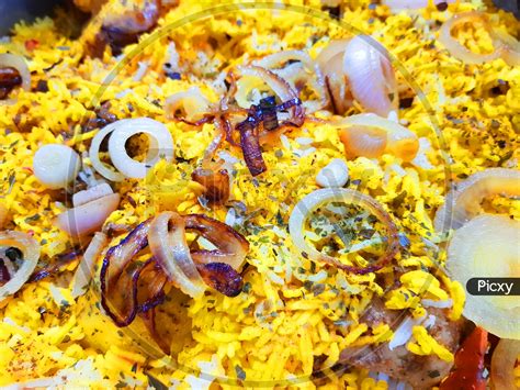 Image Of Close Up Photo Of Hyderabadi Dum Handi Biryani Garnished With