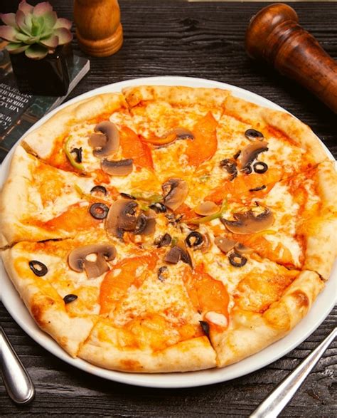 Free Photo Pizza Margarita With Black Olives Mushrooms Tomato Sauce Tomato Slices And