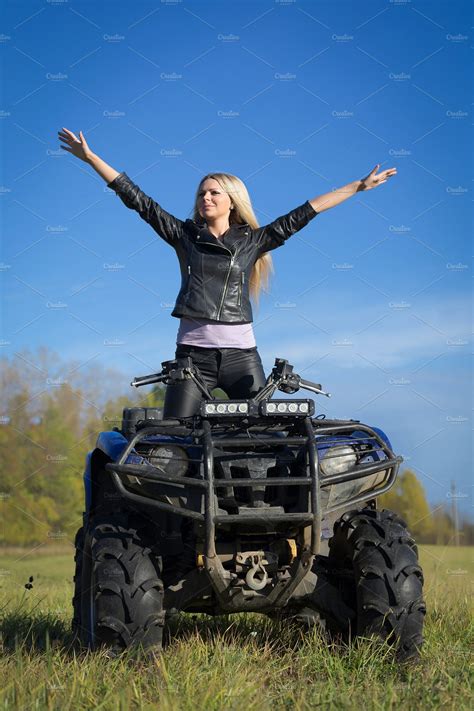 Elegant Blonde Woman Riding Atv Featuring Adventure Atv And