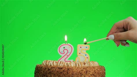 Cake with lighted candle number 25. Green screen background. Isolated ...