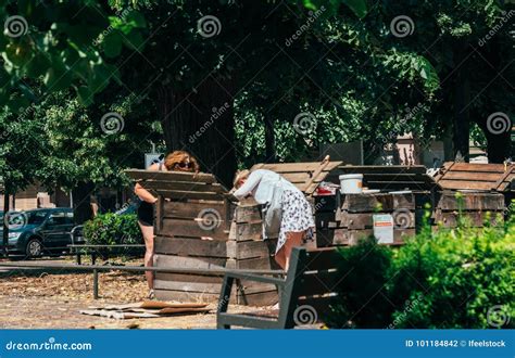 People Composting In Urban Environment Senior Women Composting