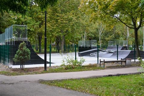 Premium Photo | Skatepark ramps in the park on autumn