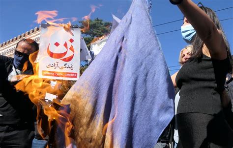 Mahsa Amini Women Cut Hair And Burn Hijabs Outside Iran Embassy In It