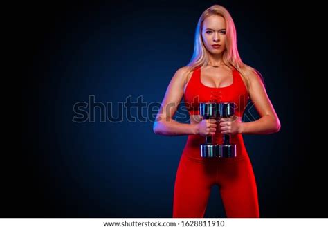 Strong Athletic Blonde Woman Bodybuilder Dumbbells Stock Photo