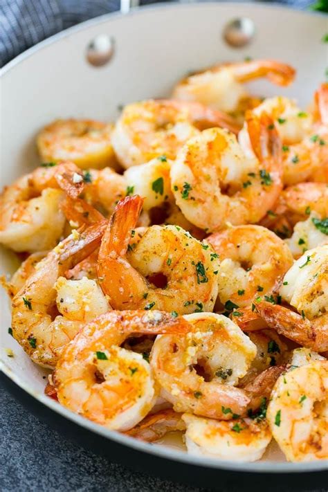 A Pan Of Garlic Butter Shrimp In A Savory Sauce Finished Off With Chopped Parsley Cooked