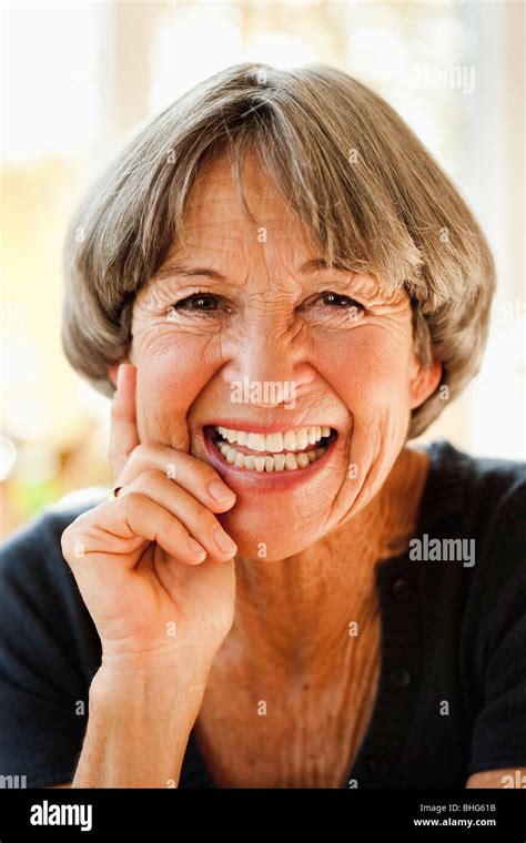 Old woman smiling at viewer Stock Photo - Alamy