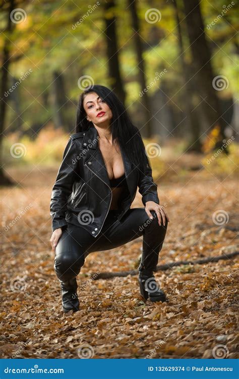 Beautiful Dark Haired Young Woman Wearing A Black Bra Leather Jacket