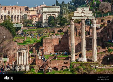 Visiting Roman Forum Tourists Walking Among Ancient Ruins With