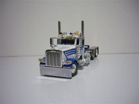 Dcp First Gear White With Blue Stripes Tri Axle Peterbilt